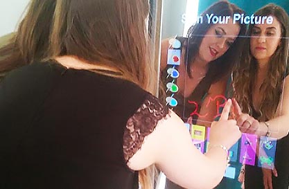 Girls signing Magic Mirror